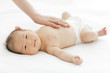 © amanaimages - Baby lying on back