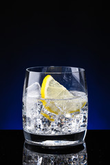 Wall Mural - Glass glass of water with lemon