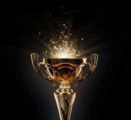 champion golden trophy on black background