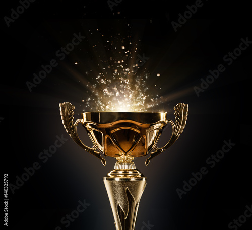Fotografía Champion golden trophy on black background