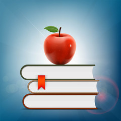 Wall Mural - Red apple lying on a pile of books.