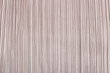 Soft pink pleated fabric. Plisse fabric texture  background.