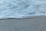 Fototapeta Do pokoju - Surf and sand (Ocean waves washing sand )