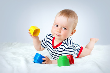 Wall Mural - Nine month old baby lying in the bed on white blanket