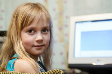 Little girl at the computer