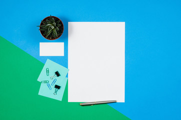 Poster - Mock-up magazine or catalog on colorful table. White page or notepad on modern background. Blank copy space for mockups or simulations.