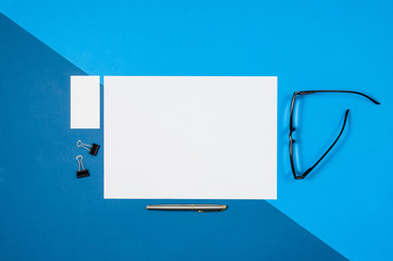 Poster - Mock-up magazine or catalog on colorful table. White page or notepad on modern background. Blank copy space for mockups or simulations.