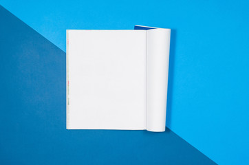 Poster - Mock-up magazine or catalog on colorful table. White page or notepad on modern background. Blank copy space for mockups or simulations.