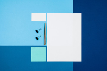 Poster - Mock-up magazine or catalog on colorful table. White page or notepad on modern background. Blank copy space for mockups or simulations.