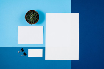 Poster - Mock-up magazine or catalog on colorful table. White page or notepad on modern background. Blank copy space for mockups or simulations.