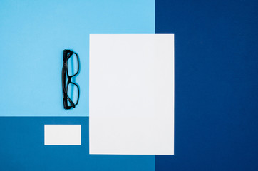 Poster - Mock-up magazine or catalog on colorful table. White page or notepad on modern background. Blank copy space for mockups or simulations.