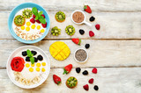 Fototapeta Kuchnia - Fruits and berries breakfast oatmeal porridges