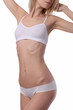 © dream@do - Beautiful slim woman wearing white underwear isolated. Perfect Slim Body, waist, belly, abdomen close up. Sport, fitness, Dieting results. Waxing, laser hair removal treatment.