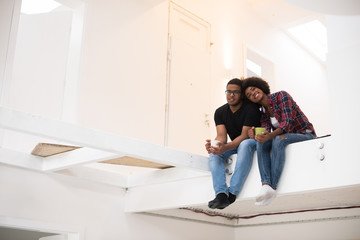 Wall Mural - couple having break during moving to new house