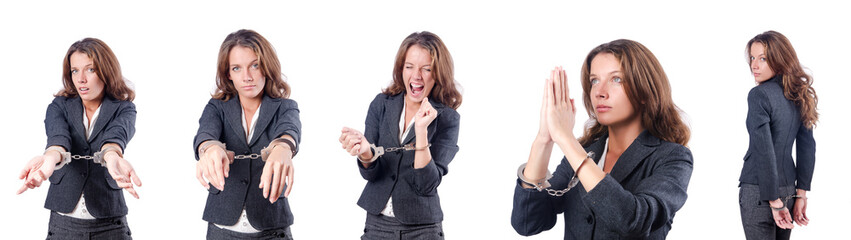 Wall Mural - Female businesswoman with handcuffs on white