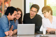 © livertoon - Asian Team group freelancer are brainstorming and meeting at coffee shop cafe. Feeling funny and happy.