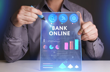 Business, Technology, Internet and network concept. Young businessman working on a virtual screen of the future and sees the inscription: Bank online