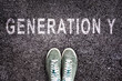 Text Generation Y written on asphalt with shoes