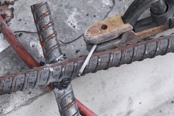 welding Steel,  on concrete floor  in construction site