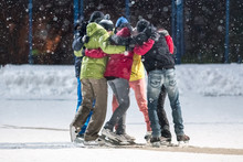 Group Of Young People Embrace On A Skating Rink