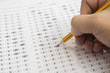 © Have a nice day  - A pencil sitting on a test bubble sheet and alarm clock, optical form of an examination,Answer sheet with pencil,Standardized test form with answers bubbled and a black pencil,selective focus,vintage