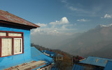 Fototapeta  - blue houses in a kind on Annapurna,dawn in the windows,Nepal