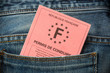 French pink driving license in the rear pocket of blue jeans, driving licence test concept
