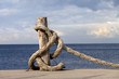 Rope on seafront and cloudy sky in sun autumn day