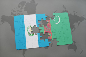 puzzle with the national flag of guatemala and turkmenistan on a world map