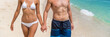© Maridav - Body care sexy people in swimwear on beach banner background. Couple holding hands, woman in bikini, man in swim trunks showing toned abs stomach for healthy fitness concept.