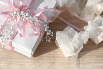 Wall Mural - Beautiful gift boxes with bows on light background