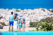 © travnikovstudio - Family of four with beautiful view in luxury hotel
