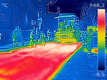 Infrared Thermovision Image Workers On Asphalting Road Street