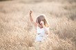© natalialeb - Emotional child on wheat field at sunset,pastel