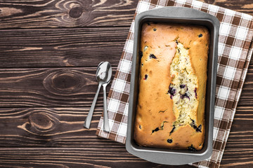 Homemade berry cake on rustic wooden background