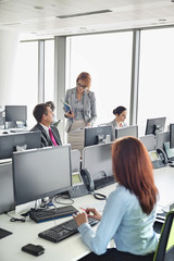 Wall Mural - Business people working in an open plan office