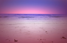 Glowing Purple And Pink Hue Sunset Over The Gulf Of Mexico