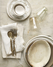 Beige Dishes On Marble With Twine And Linen.