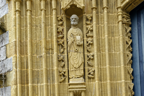 Exterior sculpture at the entryway to the 15th Century A Poster