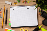 Fototapeta Perspektywa 3d - Open notepad with office supplies