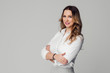 © SokRom - Young businesswoman posing against white background