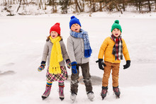 Three Children On Ice Skates Singing Carols