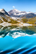 Glacier Bay National Park, Alaska, USA. Amazing glacial landscape view from cruise ship vacation travel showing mountain peaks and glaciers on clear blue sky summer day.