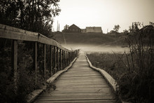 Old Wooden Bridge To Village Hill. Vintage Gothic Rustic Black And White Photo