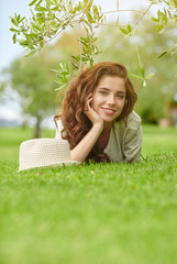 Poster - Pretty smiling girl relaxing outdoor