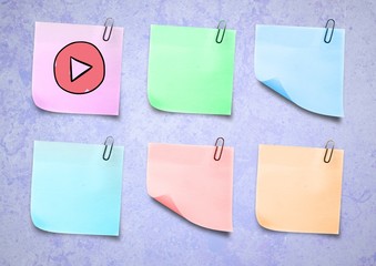 Poster - sticky note play icon against a lavender background