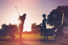 Composite Image Of Golfing Couple Playing Together