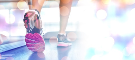 Poster - Composite image of womans feet running on the treadmill 
