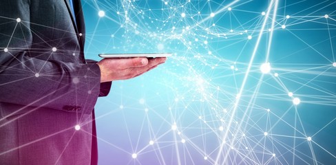 Poster - Composite image of businessman holding a digital tablet