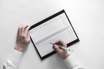 sheet of paper on the desk and hands, the handle, top view,
